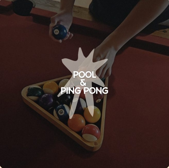 Hands placing brightly colored pool balls on a red pool table; overlay reads 'POOL & PING PONG'.