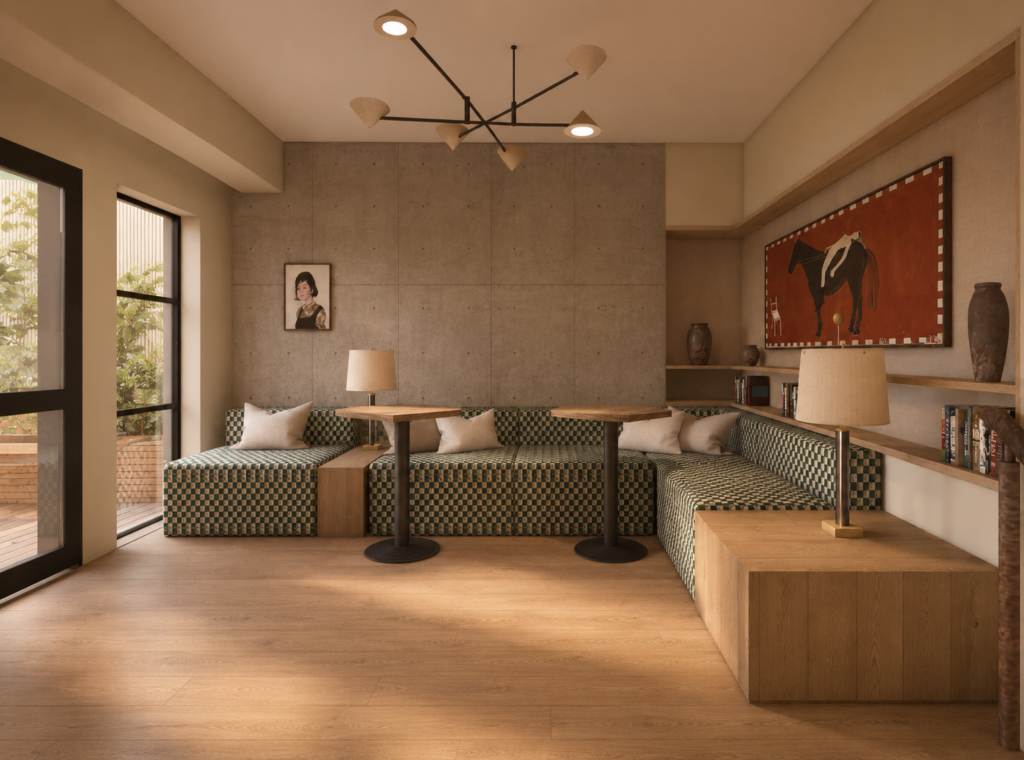 Cozy living room lounge with a checkered green sofa, wooden tables, and warm natural light from large glass doors to a patio.