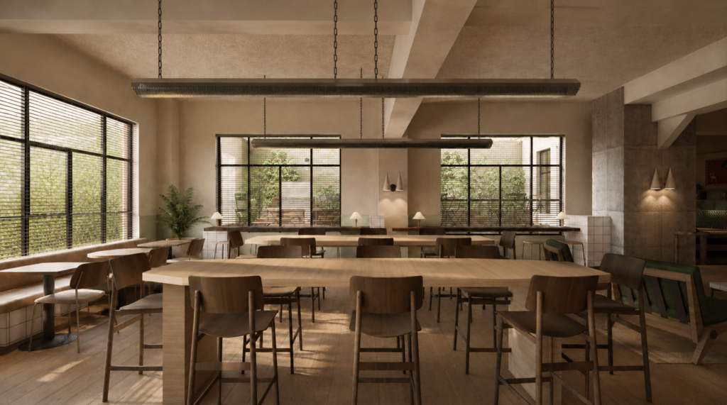 Bright, modern cafe interior with long wooden tables, brown chairs, and large windows filling the space with natural light.
